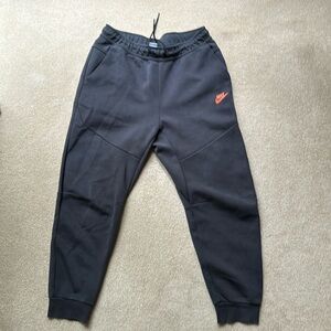 Black Nike sweatpants, large, with cuffed bottoms